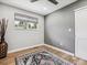 Cozy bedroom with wood floors, ceiling fan and window with light-filtering shades at 1333 W Peakview Ave, Littleton, CO 80120