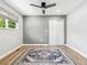 Bright bedroom featuring new floors, recessed lighting, ceiling fan, and sliding closet doors at 1333 W Peakview Ave, Littleton, CO 80120