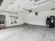Spacious garage featuring a Galaga arcade game on a concrete floor at 1333 W Peakview Ave, Littleton, CO 80120