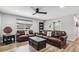 Comfortable living room features refinished hardwood floors, modern ceiling fan, and modern décor at 1333 W Peakview Ave, Littleton, CO 80120
