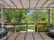 Shaded outdoor patio with a lush green view at 1333 W Peakview Ave, Littleton, CO 80120