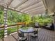 Outdoor patio featuring a glass table and lush green backyard at 1333 W Peakview Ave, Littleton, CO 80120