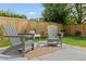 Outdoor patio featuring Adirondack chairs and a small table, creating a cozy and inviting seating area at 9698 Queenscliffe Dr, Highlands Ranch, CO 80130