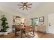 Bright dining room featuring hardwood floors, vaulted ceilings, and stylish decor, perfect for gatherings at 9698 Queenscliffe Dr, Highlands Ranch, CO 80130