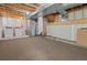 Large unfinished basement features a carpeted area, laundry hookups, and an open layout at 9698 Queenscliffe Dr, Highlands Ranch, CO 80130