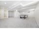 Open basement area with carpeted floors, recessed lighting, and a ping pong table for recreation at 7082 W Morraine Dr, Littleton, CO 80128