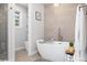 Serene bathroom with a freestanding tub and modern fixtures offering a relaxing retreat at 7082 W Morraine Dr, Littleton, CO 80128