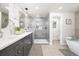 Modern bathroom featuring double sinks, a glass shower, and stylish finishes for a spa-like experience at 7082 W Morraine Dr, Littleton, CO 80128