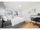 Minimalist bedroom with sleek furniture, bright windows, and ample space for relaxation and productivity at 7082 W Morraine Dr, Littleton, CO 80128