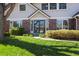Inviting front entrance with a glass door and well-maintained landscaping at 7082 W Morraine Dr, Littleton, CO 80128