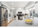 Bright kitchen featuring white cabinets, granite countertops, and stainless steel appliances at 7082 W Morraine Dr, Littleton, CO 80128