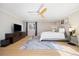 Bright main bedroom with ceiling fan, natural light and a stylish accent rug at 7082 W Morraine Dr, Littleton, CO 80128