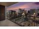 A balcony with a view of the city skyline at sunset at 1020 15Th St # 18I, Denver, CO 80202