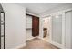 A bedroom with carpeted floors, closet system and an ensuite bathroom at 1020 15Th St # 18I, Denver, CO 80202