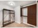 A bedroom with carpeted floors and a large wardrobe system at 1020 15Th St # 18I, Denver, CO 80202