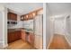 A kitchen with wooden cabinets, stainless steel appliances, and hardwood floors at 1020 15Th St # 18I, Denver, CO 80202