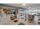 Well-maintained laundry room with multiple washers and dryers, plus folding space and convenient cart at 1020 15Th St # 18I, Denver, CO 80202