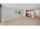 A living room featuring carpeted floors and a view of the kitchen at 1020 15Th St # 18I, Denver, CO 80202