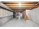 An unfinished basement with concrete walls and floors, presenting a blank canvas for future customization at 11565 Decatur St # 7D, Denver, CO 80234