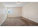 This carpeted bedroom boasts lots of space and natural light from the window at 11565 Decatur St # 7D, Denver, CO 80234