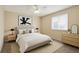 This comfortable bedroom features a full bed, and minimalist decor, perfect for relaxation at 11565 Decatur St # 7D, Denver, CO 80234