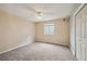 A carpeted bedroom offers natural light and a blank canvas for personal decoration at 11565 Decatur St # 7D, Denver, CO 80234
