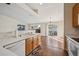 Bright kitchen with hardwood floors, stainless appliances, and lots of cabinet space at 11565 Decatur St # 7D, Denver, CO 80234