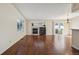 Open living room featuring a fireplace and sliding door access to the backyard at 11565 Decatur St # 7D, Denver, CO 80234