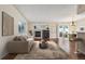 Inviting living room boasting a fireplace, wine cooler, and lots of natural light at 11565 Decatur St # 7D, Denver, CO 80234