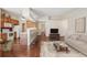 Open-concept living space with a kitchen, breakfast bar, and inviting seating area at 11565 Decatur St # 7D, Denver, CO 80234