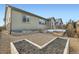 Landscaped backyard with gravel, raised garden beds, and a patio at 15485 E 115Th Ave, Commerce City, CO 80022