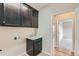 Laundry room with cabinets and a utility sink at 15485 E 115Th Ave, Commerce City, CO 80022