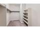 Spacious walk-in closet with shelves and hanging rods at 15485 E 115Th Ave, Commerce City, CO 80022