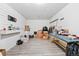 Spacious basement area with light gray floors and white paneled walls at 15627 E 51St Dr, Denver, CO 80239