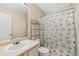 Bathroom with single sink vanity and shower-tub combo at 15627 E 51St Dr, Denver, CO 80239