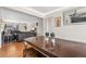 Dining room with a wooden table and a view of the living room at 15627 E 51St Dr, Denver, CO 80239