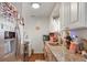 Galley kitchen featuring granite counters, wood floors, and stainless steel appliances at 4961 E Cornell Ave, Denver, CO 80222