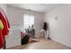 Functional laundry room featuring tile floors, natural light and storage at 4961 E Cornell Ave, Denver, CO 80222