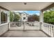 Outdoor balcony overlooks a building and mature trees at 4947 Noble Park Pl, Boulder, CO 80301