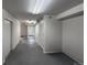 Spacious unfinished basement with utility lighting and white painted walls at 4947 Noble Park Pl, Boulder, CO 80301