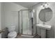 Clean and tidy bathroom featuring stand up shower, toilet and sink with tiled floors at 4947 Noble Park Pl, Boulder, CO 80301