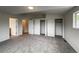 Spacious bedroom with grey carpet, white walls, and large closets at 4947 Noble Park Pl, Boulder, CO 80301