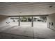 Carport of home featuring multiple parking spaces and view of home exteriors at 4947 Noble Park Pl, Boulder, CO 80301