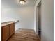 Hallway features a storage cabinet, hardwood floors, and an open doorway at 4947 Noble Park Pl, Boulder, CO 80301
