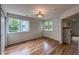 Living room features hardwood floors and bright windows with outside views at 4947 Noble Park Pl, Boulder, CO 80301