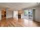 Spacious living area boasts hardwood floors, fireplace, and sliding door access to a balcony at 4947 Noble Park Pl, Boulder, CO 80301