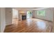 Spacious living room featuring hardwood floors, fireplace and sliding doors to the outdoor at 4947 Noble Park Pl, Boulder, CO 80301