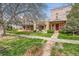 Neighborhood street view showing homes with well-kept lawns and sidewalks at 2222 N Williams St, Denver, CO 80205