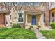 Charming home featuring a blue front door, red-tiled roof, and well-maintained lawn at 2222 N Williams St, Denver, CO 80205