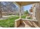 The front porch and view of the street with mature trees and sidewalk at 2222 N Williams St, Denver, CO 80205